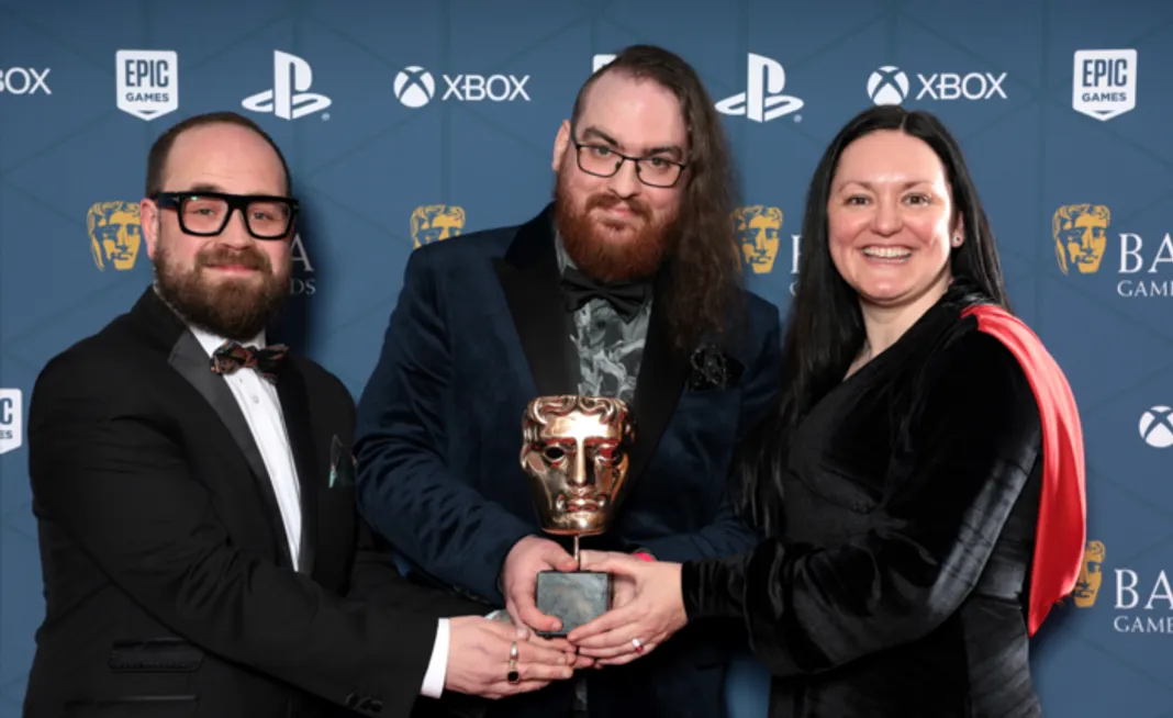 LONDON, ENGLAND - MARCH 30: George Morgan, Laurence Phillips and Julie Craig with the Game Design Award for 'Vampire Survivors' during the 2023 BAFTA Games Awards at the Queen Elizabeth Hall on March 30, 2023 in London, England. (Photo by Shane Anthony Sinclair/BAFTA/Getty Images for BAFTA)